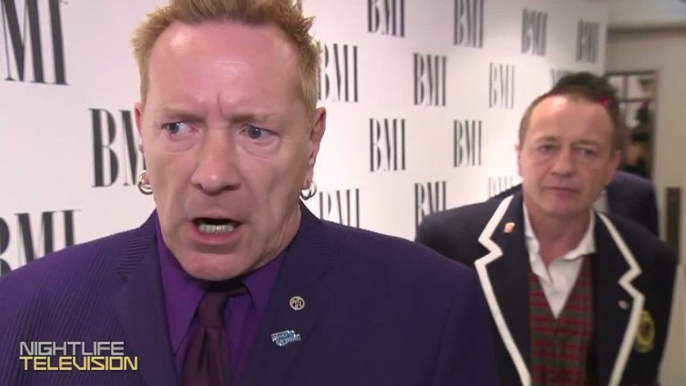 Johnny Rotten gets honored & clowns Miley Cyrus at the BMI London Awards