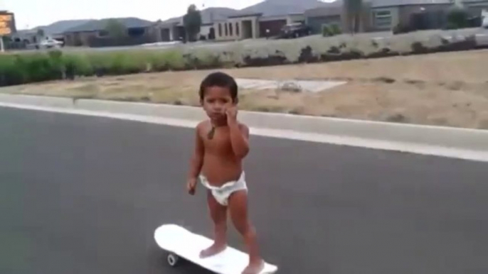 Two-year-old skateboarder shows his skills