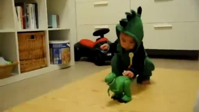 So cute baby scared by dinosaur toy... Hilarious!