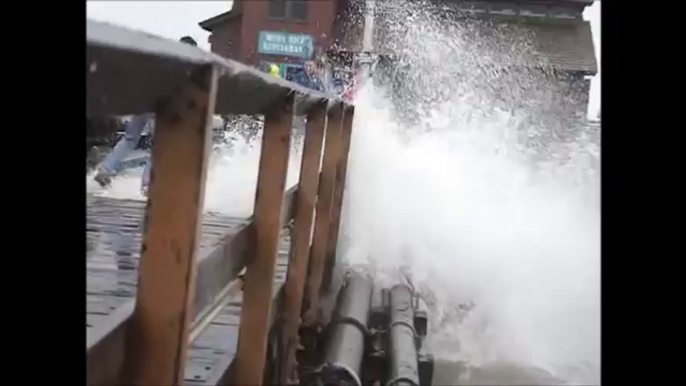Storm Surge Causes Large Waves to Slam Pier