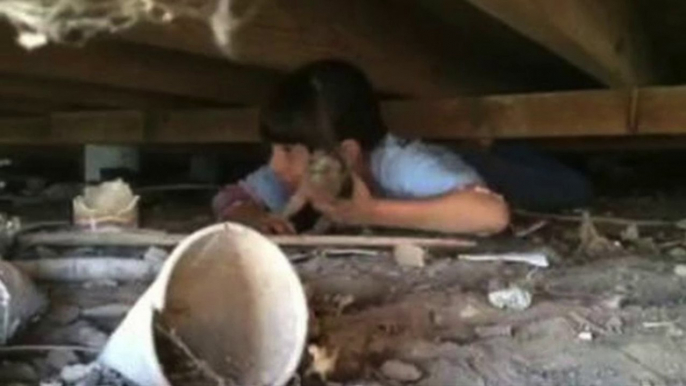 Child Crawls Under Barn to Rescue Puppy