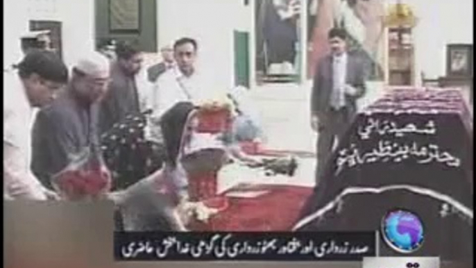 President Asif Ali Zardari along with daughter Bakhtawar Bhutto Zardari showering flowers on the grave of Benazir Bhutto in Garhi Khuda Bakhsh