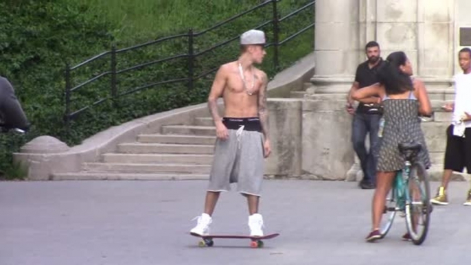 Justin Bieber Skateboards Around New York Shirtless
