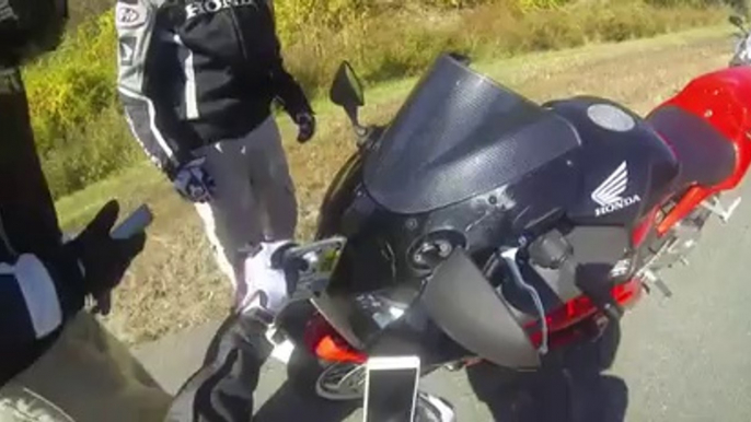 Biker almost killed and decapitated by flying license plate!