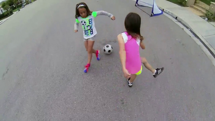 So cute ittle girls playing street Soccer