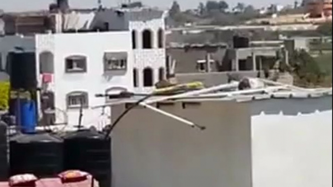 Israel Mortar Hitting Roof of Gaza Building To Warn of imminent Israeli Strike