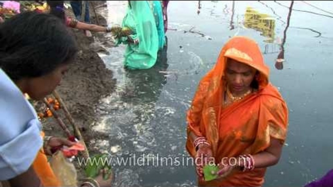 Hindu devotees perform rituals during Chhath Puja