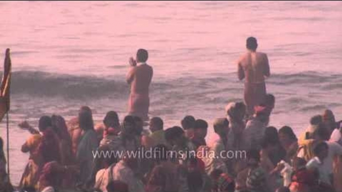 Hindu devotees performing rituals at the banks of ganga : Gangasagar Mela