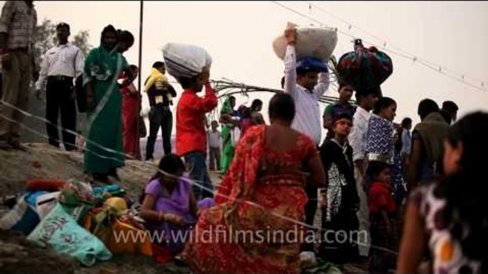 Devotees throng a ghat on river Yamuna to worship Sun God on' Chhath Puja' in Delhi