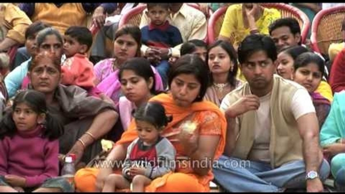 Visitors enjoying the performances at Surajkund mela