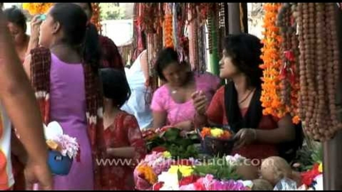 Flower vendor, outside the Jagat Guru Shri Shri 1008 Shri Shankracharya Mandir, Nepal