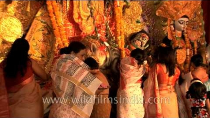 Lady, performing Mahasnan ritual of Durga Puja