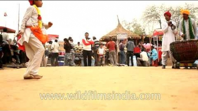 Folk dance being performed by a boy at Surajkund mela 2013