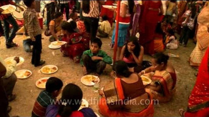 Devotees having prashad during Durga Puja