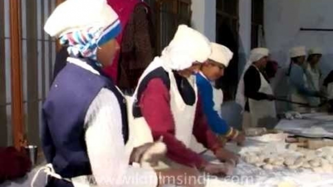 Tihar prisoners kneading Roti dough