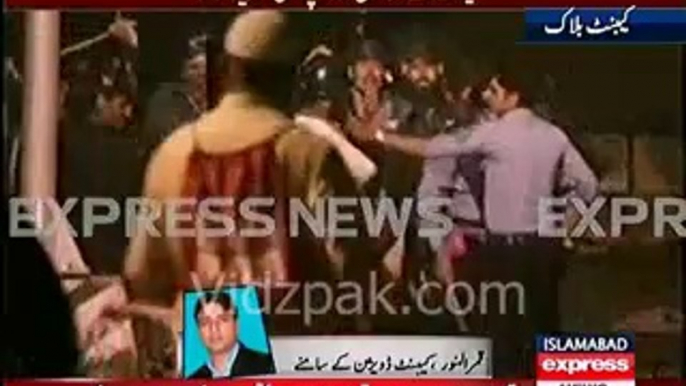 Islamabad Police beating Protestor with wooden sticks