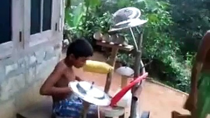 indian boy playing heavy metal drums .. kid rock