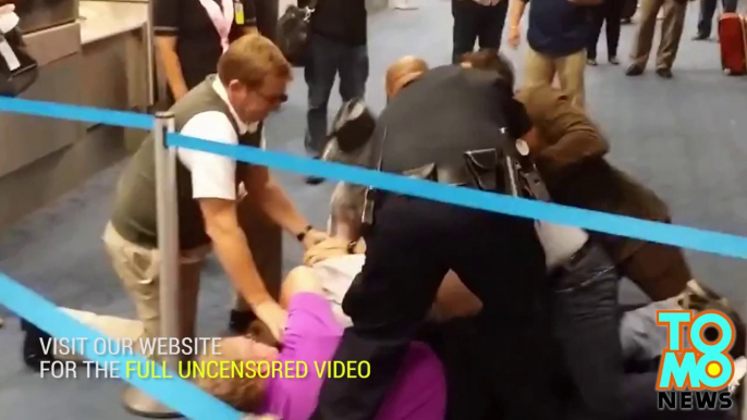 Racist homophobe attacks man for wearing pink shirt, gets taken down at Dallas airport.