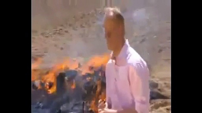 Don't inhale!' BBC reporter gets so high standing next to stack of burning opium, heroin and hash, he can't finish his report