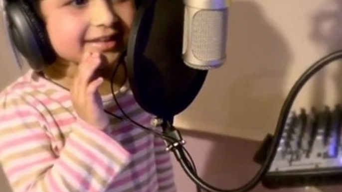 A cute kid sing a song