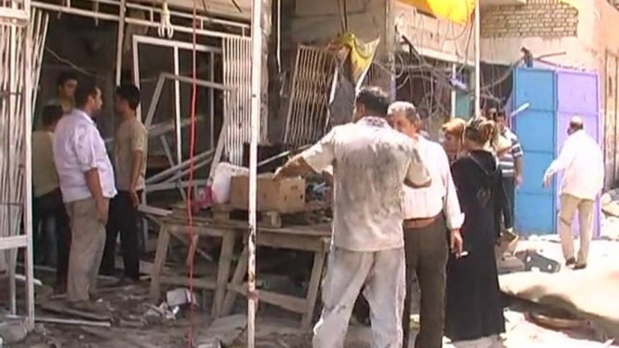 Baghdad suicide bombers kill 26 in crowded street