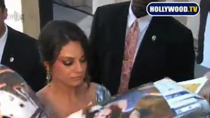 Mila Kunis Signs Autographs At  For Fans.