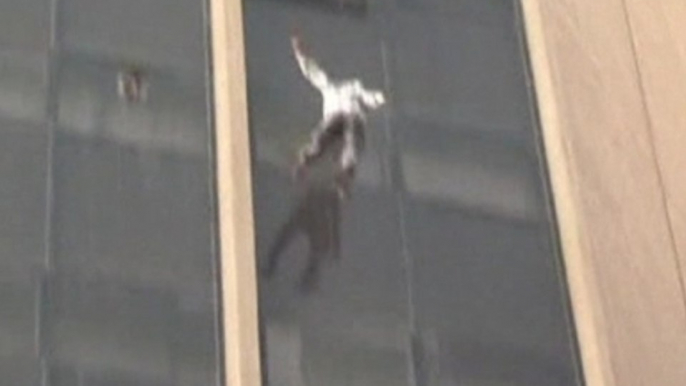 Man falls to his death after clinging to 10th floor window of burning building