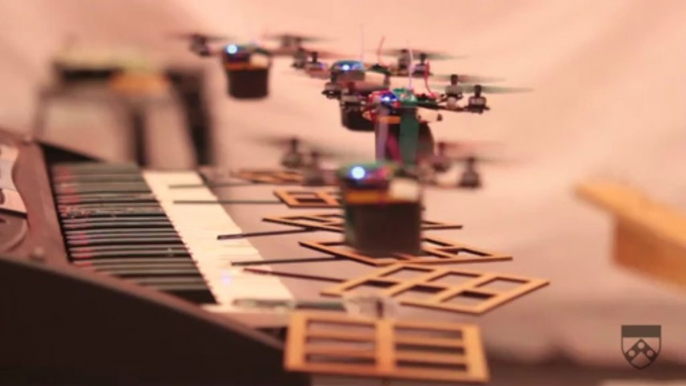 Robot quadrotors perform james bond theme