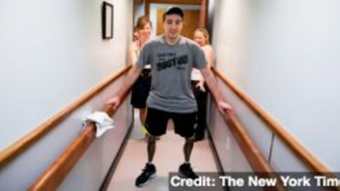 Boston Bombing Victim Takes First Steps on Prosthetic Legs
