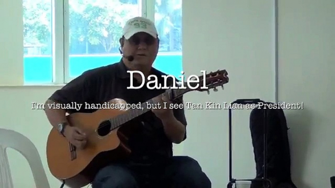 Visually handicapped Daniel singing in support of Tan Kin Lian