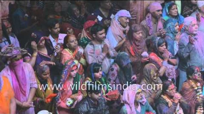 Hindus fold their hands in prayer, prior to Holi festive rituals