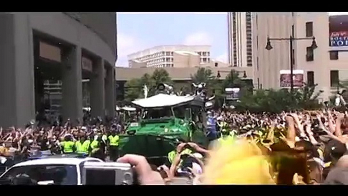 Chara and Thomas. 2011 Boston Bruins NHL Championship Parade. Boston MA. Holding Stanley Cup Trophy.