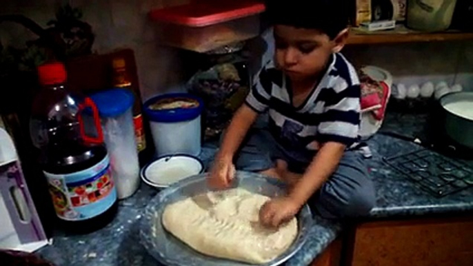 Toddler Kneading Dough in the Kitchen