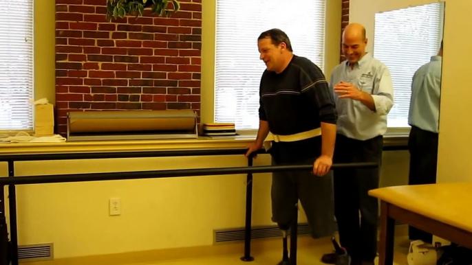 Double Amputee Takes First Steps on Prosthetic Legs.MOV
