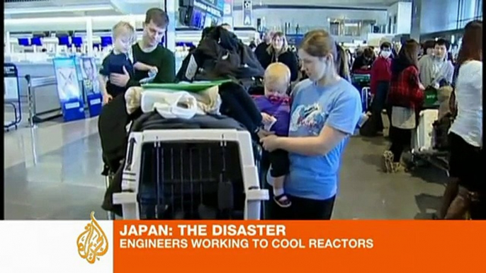 Japan engineers working to cool reactors