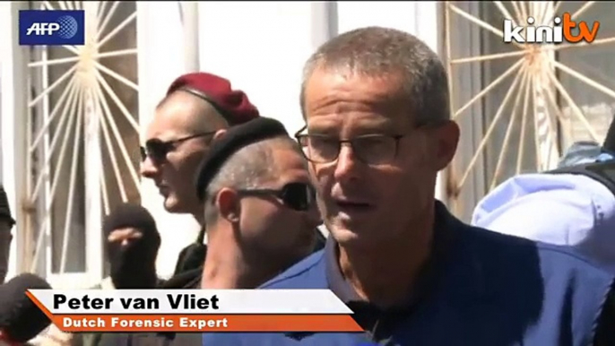 Dutch investigators inspect MH17 bodies at east Ukraine station