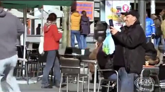 Cristiano Ronaldo disguised as beggar plays football in Madrid square