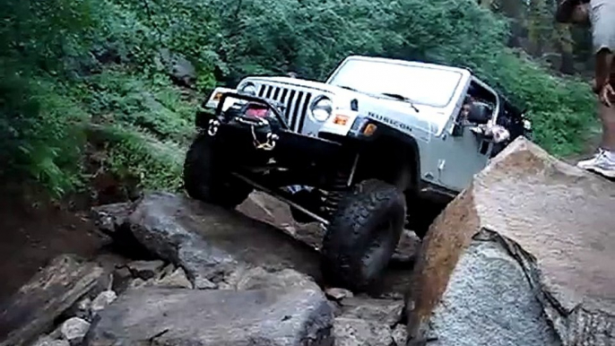 Jeep Rubicon Crawling Over Large Rocks