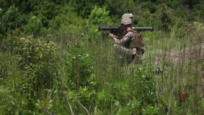 US Marines in Forest Shooting Lots of Weapons  SMAW Rocket M4 Mossberg 590 etc..