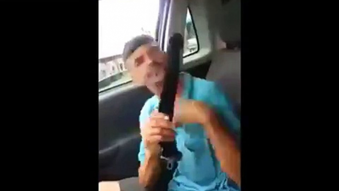 Man having  a hard time buckling the seat belt