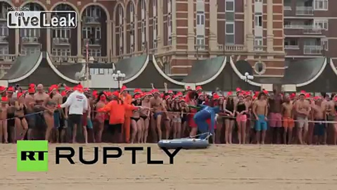 Netherlands: See THOUSANDS storm The Hague beach for first dip of 2015