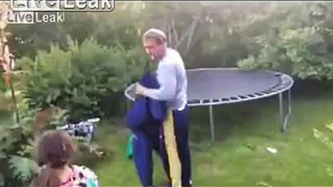 drunk man tries his skills on a trampoline