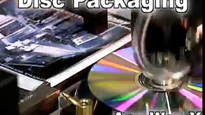 Automated CD packaging machine - automatically insert discs into sleeves