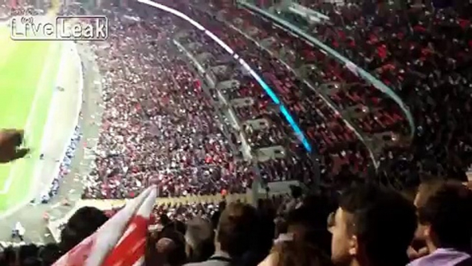 Throwing a paper plane of the upper ring in a football stadium