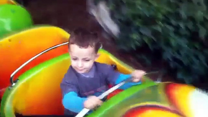 Toddler rides on the wiggly worm train