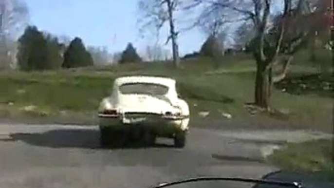 1966 Jaguar E-Type (XKE) followed by 1974 Porsche RS