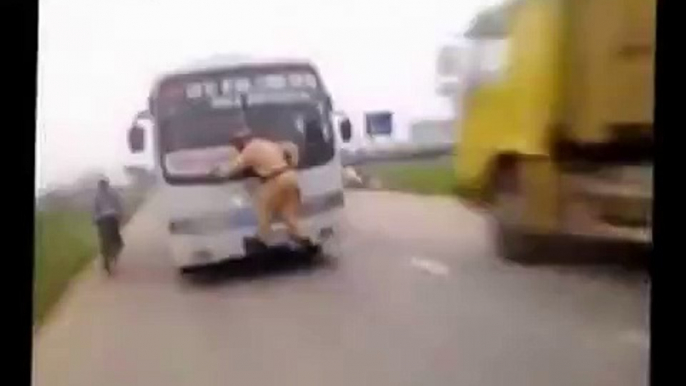 Chinese cop trying to stop a BUS!! LoL!!