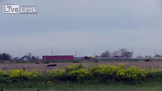 Bi-Plane Flying Ag Pilot Fails to Scare the Crop Out of Cows While Spraying