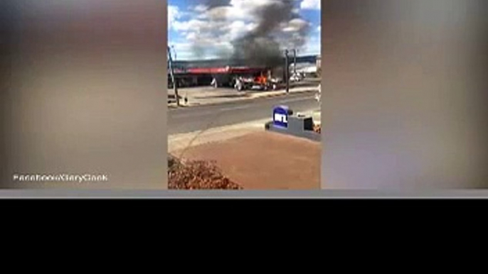 Moment an elderly woman is pulled from burning car in petrol station