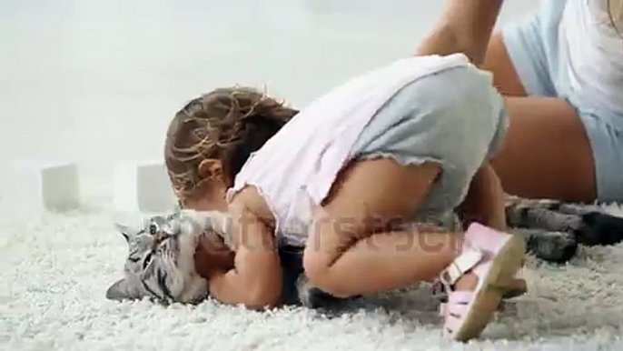 Cute girl cuddling with her furry friend